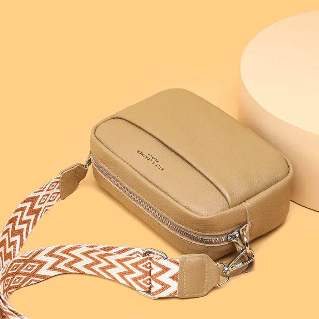 New3 women's fashion crossbody bag. Chic geometric strap, perfect for modern, stylish everyday wear.