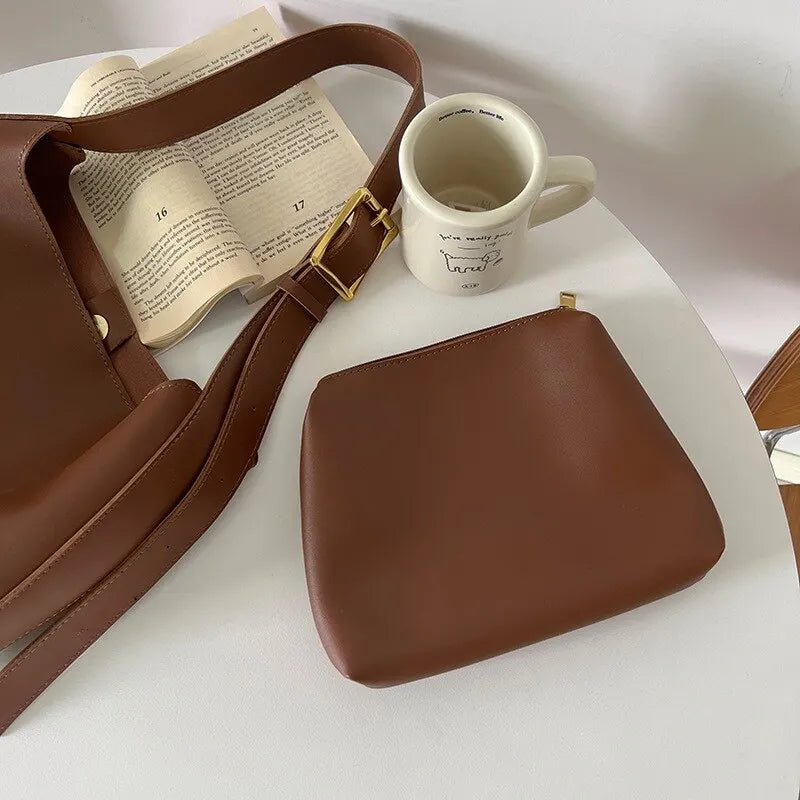Brown synthetic leather shoulder bag for women. A stylish and practical everyday crossbody bag with an adjustable strap.