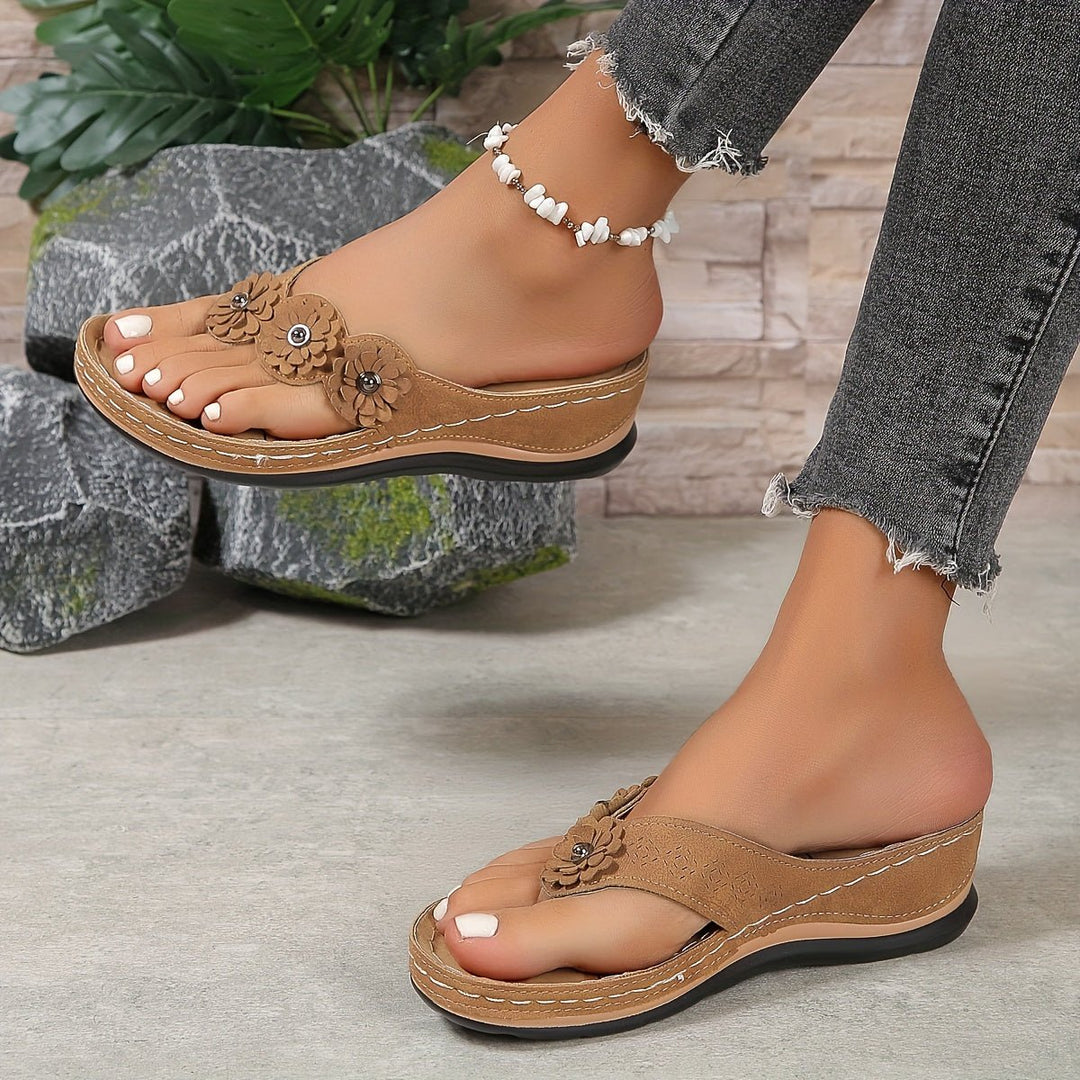 Feminine floral print wedge sandals with platform sole. Casual summer slip-on footwear for women.