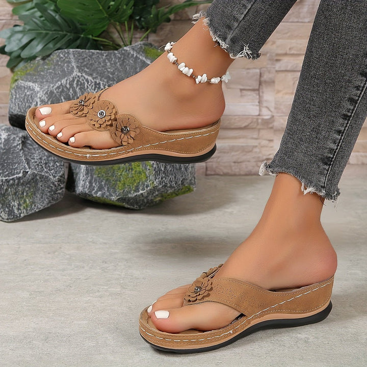 Feminine floral print wedge sandals with platform sole. Casual summer slip-on footwear for women.
