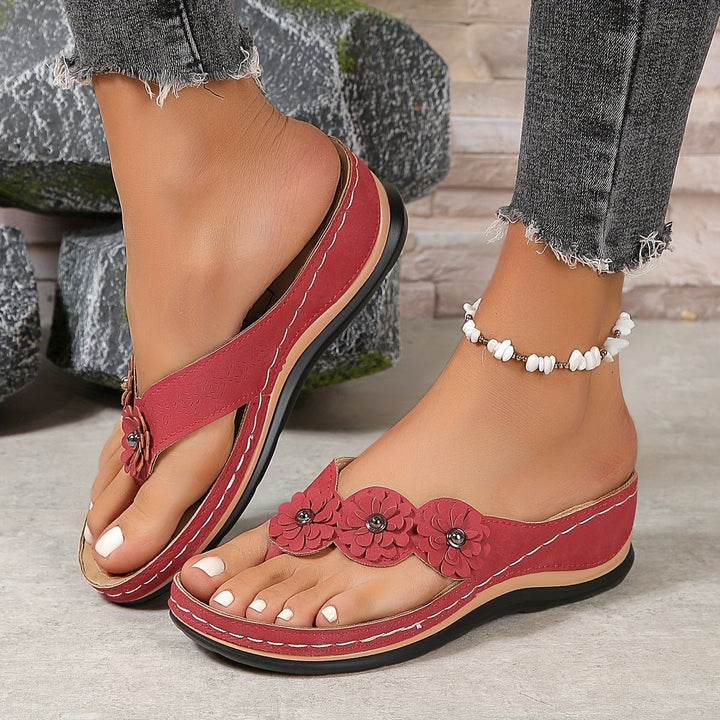 Feminine floral platform wedge sandals for women. Comfortable slip-on thong design, perfect for summer.