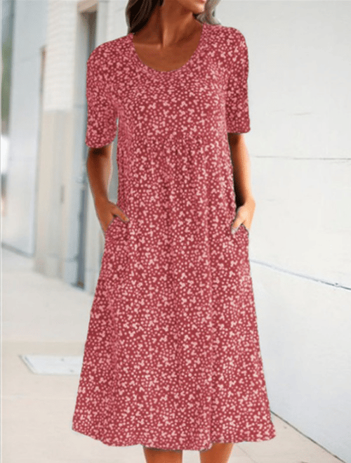 Effortless women's floral summer dress with a round neck & pockets, ideal for beach or daily wear.