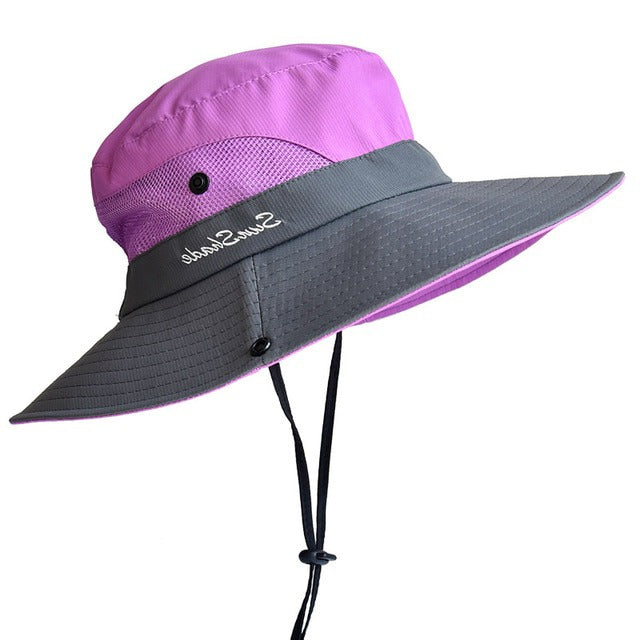 Women's stylish foldable wide-brim sun hat with UV protection, perfect for beach, travel, and summer outdoor wear.