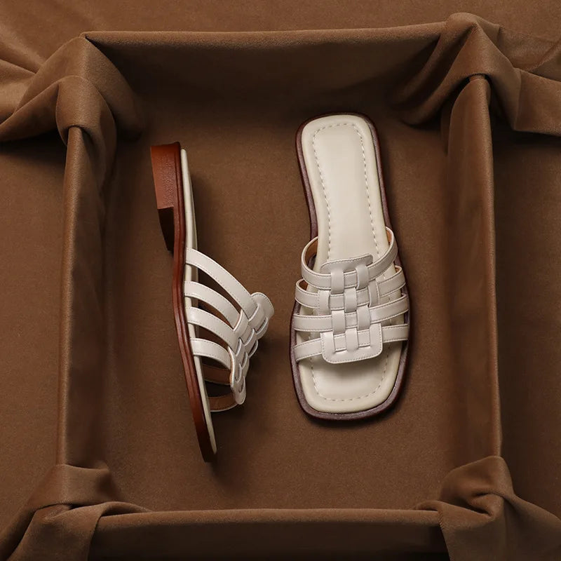 Cushioned women's brown flat slide sandals with a chic geo cutout design for all-day comfort.