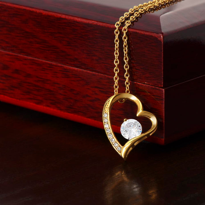 Women's stylish gold heart necklace, symbol of love & connection. Delicate anniversary gift jewelry.