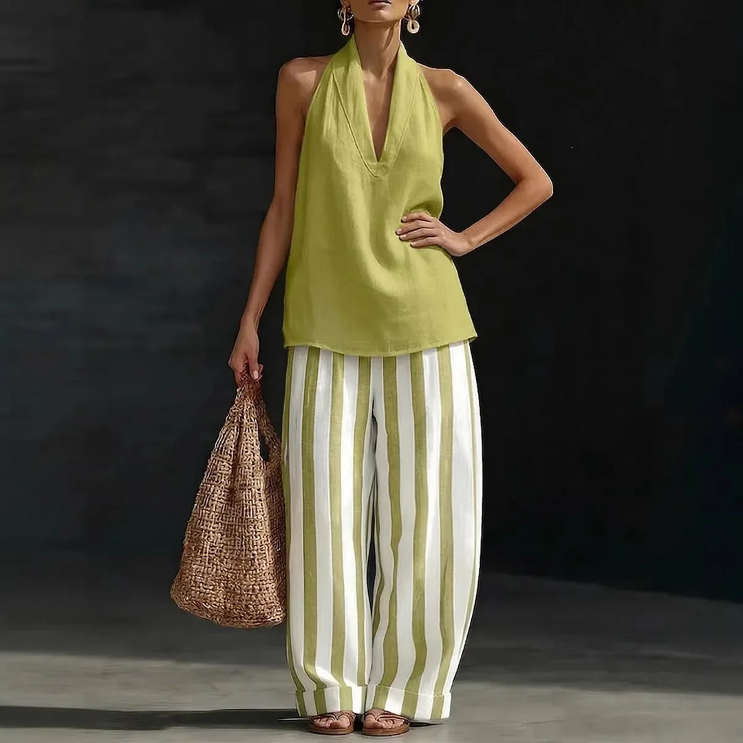 Comfortable women's two-piece halter top & high-waist wide leg pants set. Ideal for vacation.