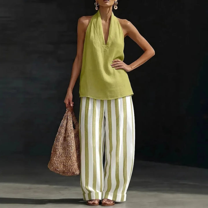 Comfortable women's two-piece halter top & high-waist wide leg pants set. Ideal for vacation.