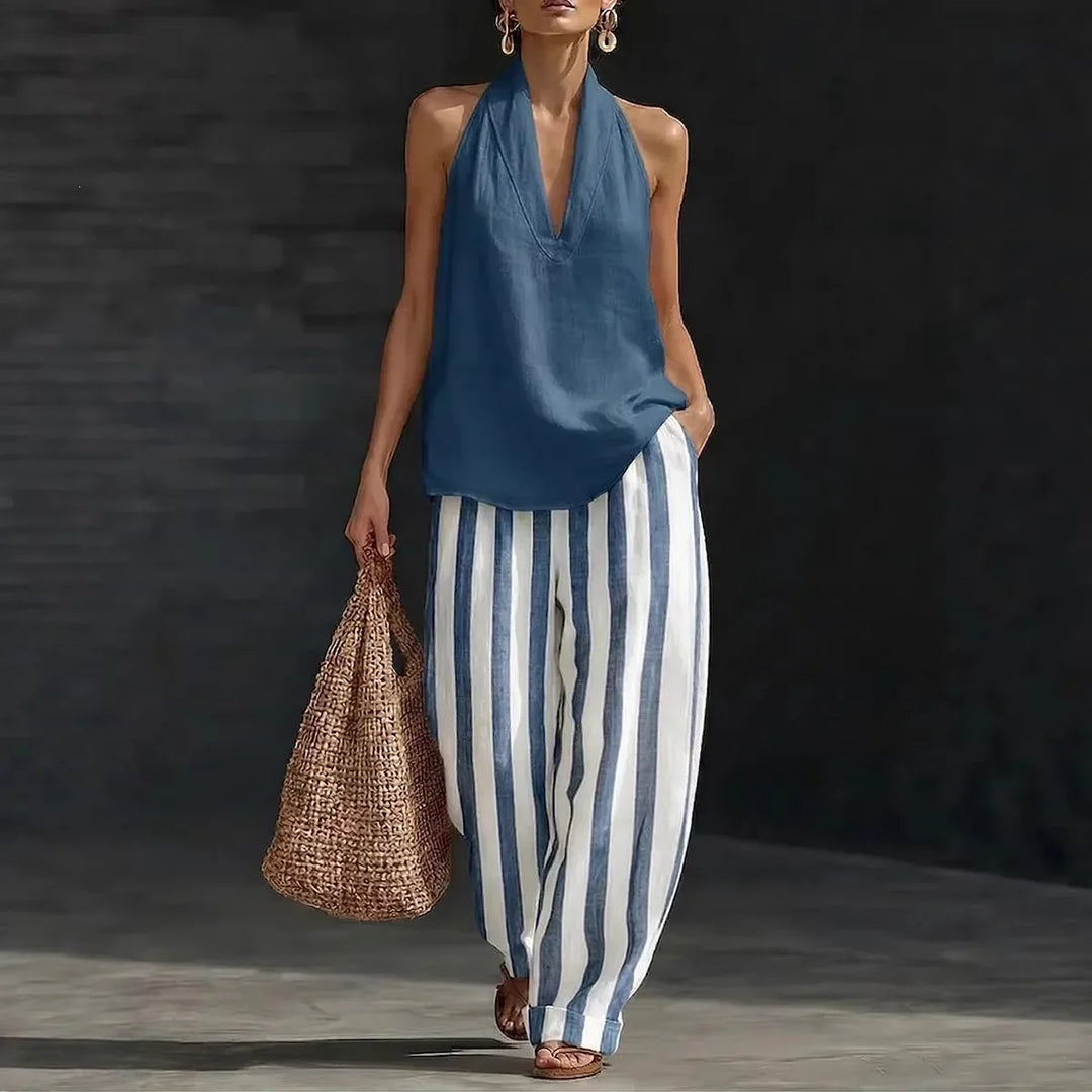 Elegant women's two-piece halter top & wide leg pants set for casual or vacation wear.