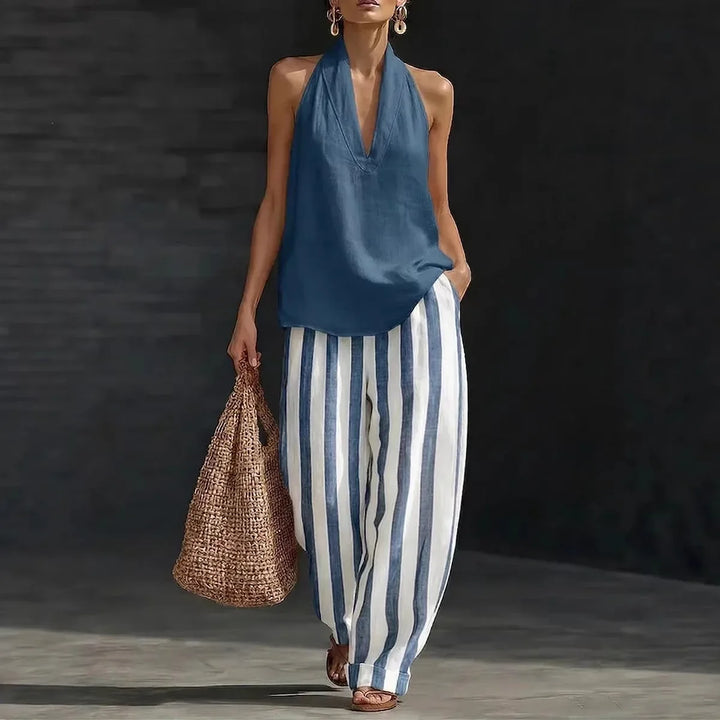 Elegant women's two-piece halter top & wide leg pants set for casual or vacation wear.