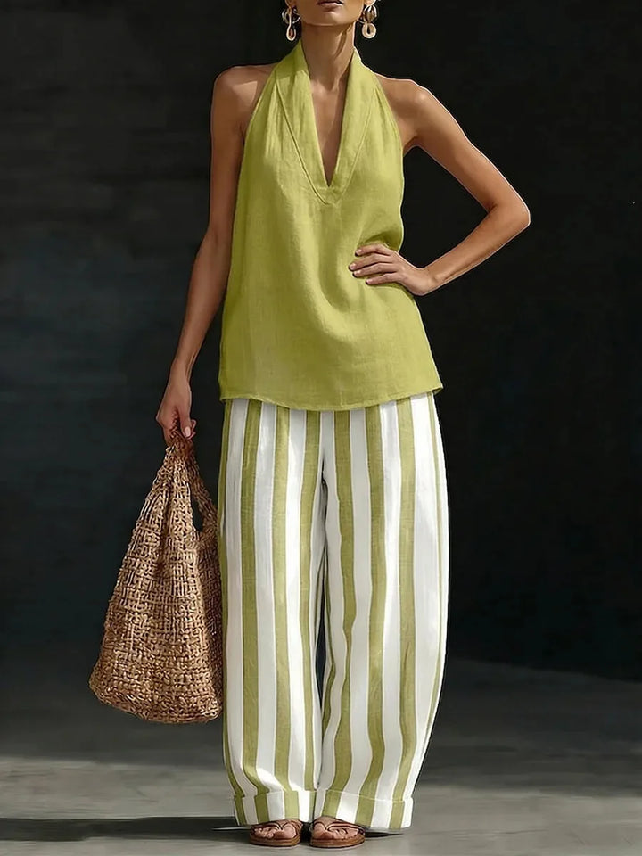 Casual women's two-piece outfit with a trendy halter top and flowing wide leg pants.