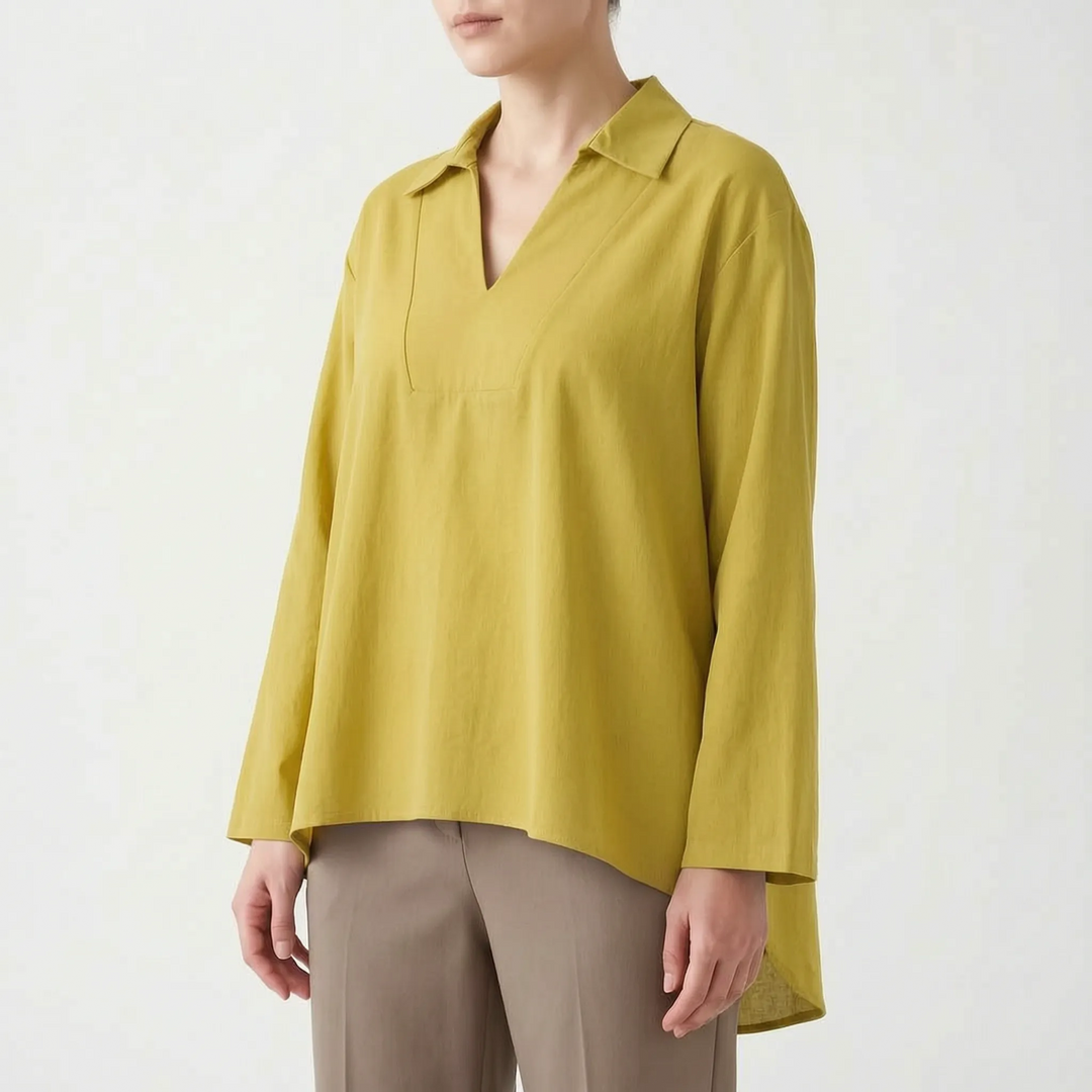 Loose fit women's tunic top with a stylish high-low hem. Elegant V-neck design for casual or smart casual looks.