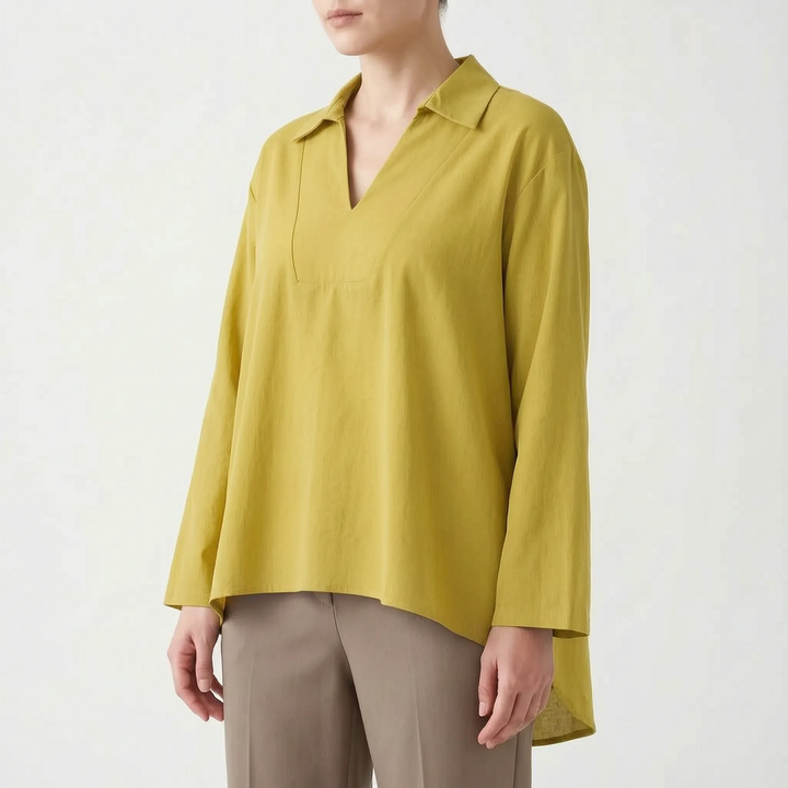 Loose fit women's tunic top with a stylish high-low hem. Elegant V-neck design for casual or smart casual looks.