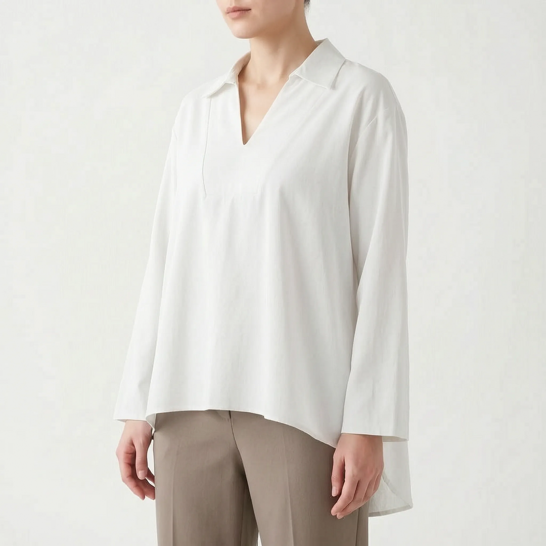 Modern women's casual tunic top. High-low hem and loose fit ensure ultimate comfort and versatile style.