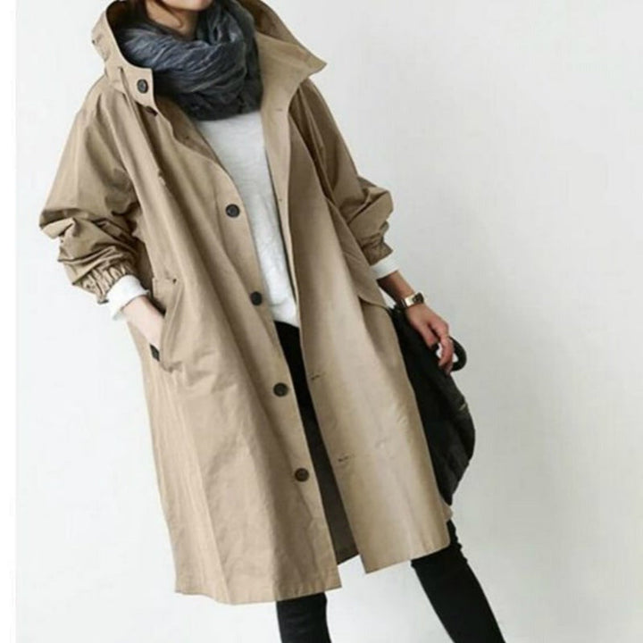 Women's stylish hooded trench coat, perfect all-weather outerwear for versatile protection and fashion.