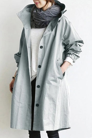 Ladies hooded trench coat, offering stylish all-weather protection. A versatile raincoat for women's fashion.