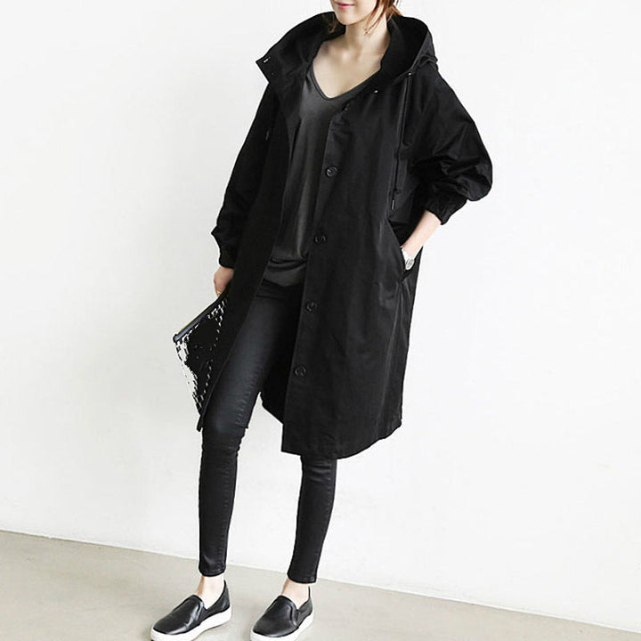 Women's all-weather hooded trench coat, a stylish and practical long raincoat for versatile outerwear.