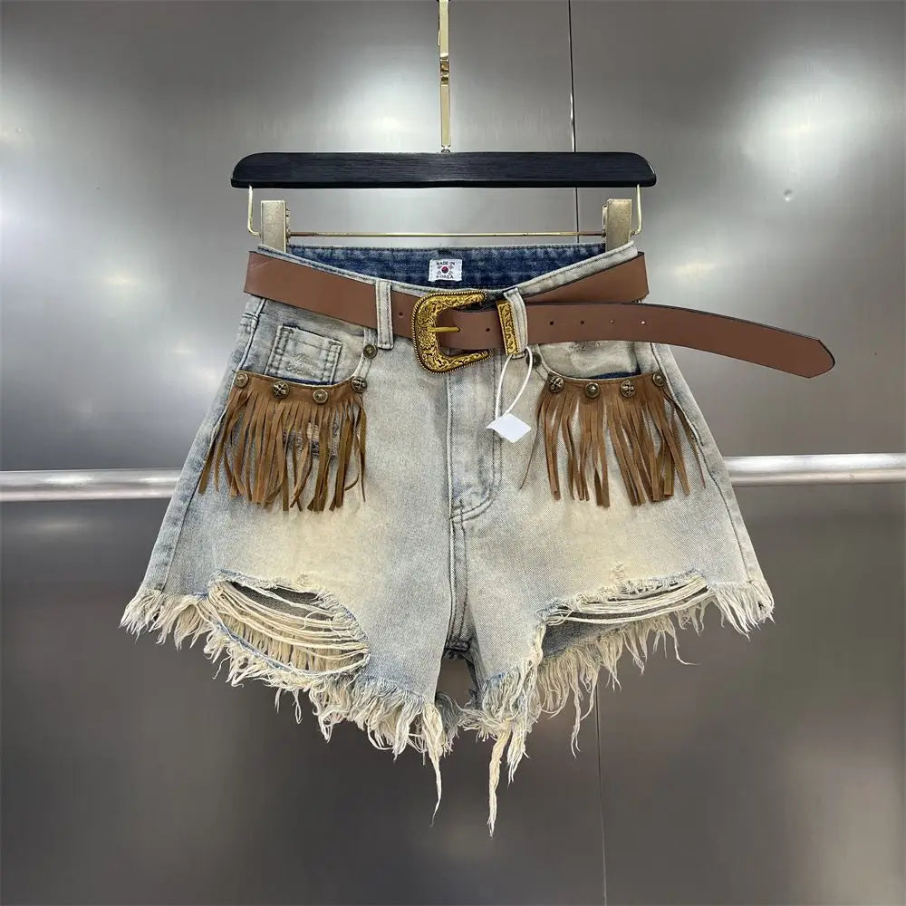 Women's stylish khaki fringe cut-off shorts for summer. Trendy casual warm weather apparel.