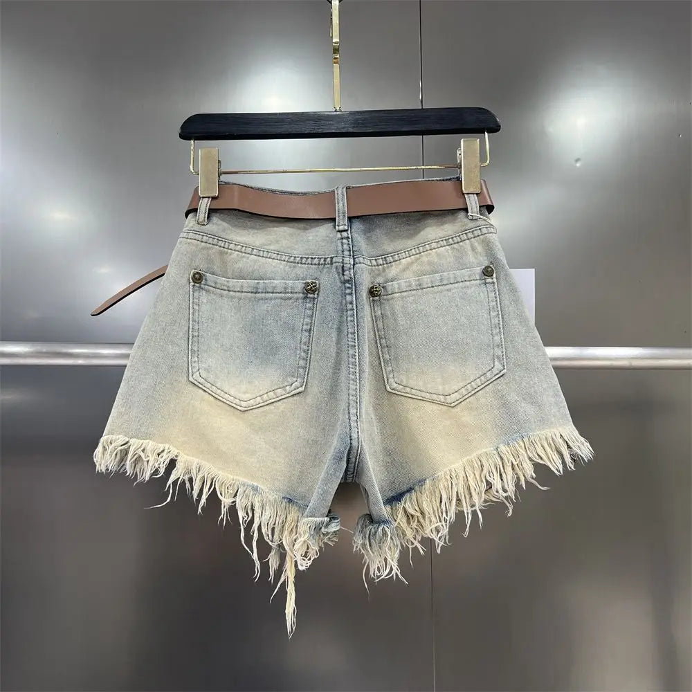 Casual women's khaki cut-off shorts with stylish fringe hem, perfect for warm weather.