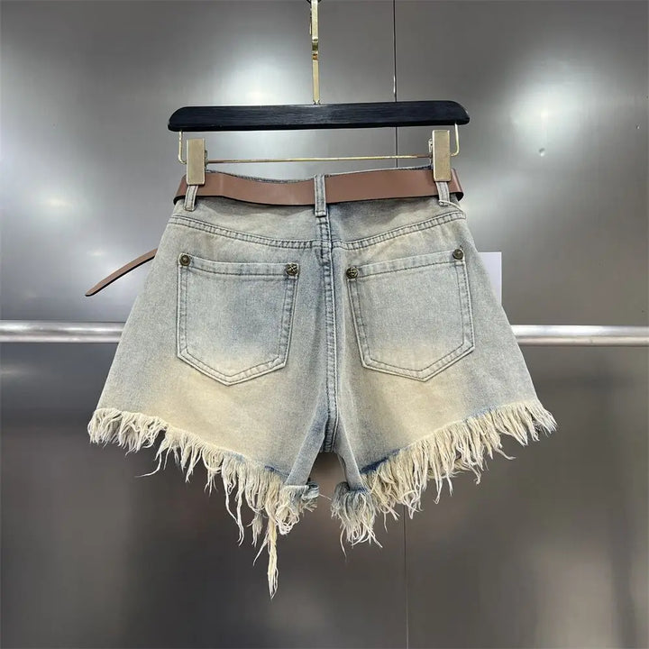 Casual women's khaki cut-off shorts with stylish fringe hem, perfect for warm weather.