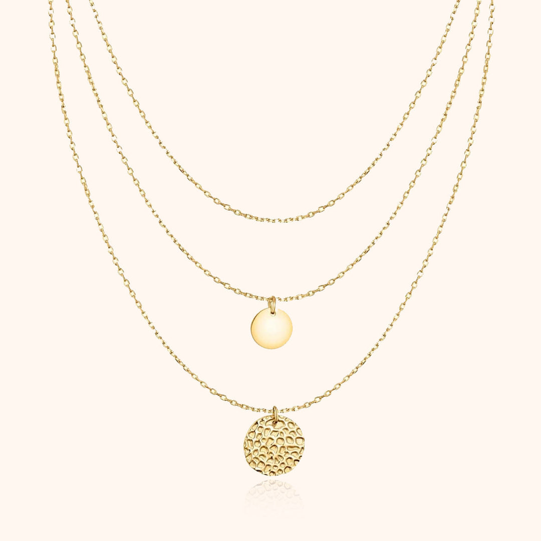 Stylish women's layered gold-plated necklace, featuring multiple delicate circle pendants for a modern elegant look.