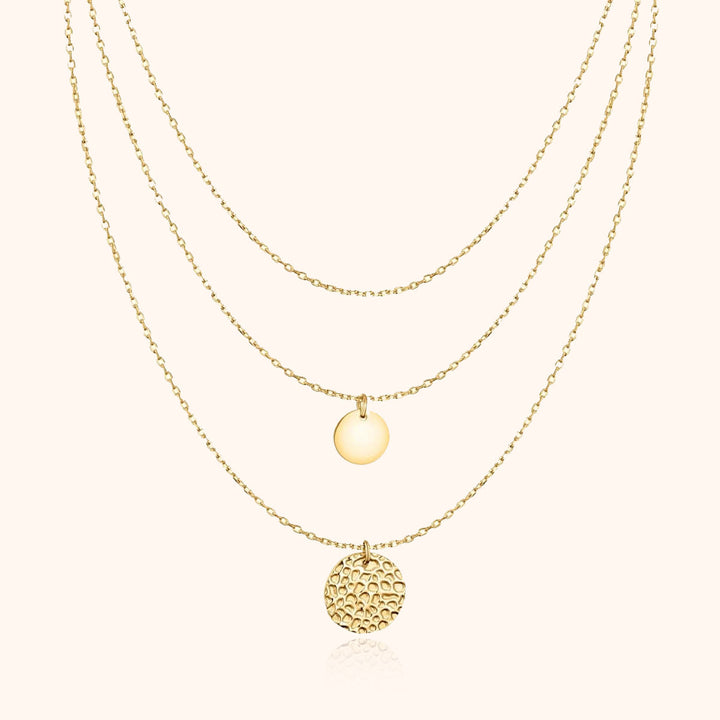 Stylish women's layered gold-plated necklace, featuring multiple delicate circle pendants for a modern elegant look.
