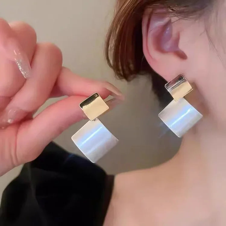Fashionable women's layered square clash earrings. Modern two-tone silver & gold, a chic and stylish statement accessory.