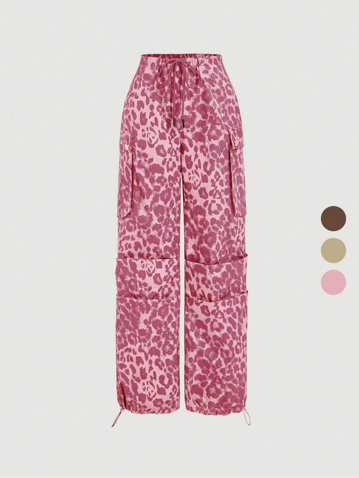 Fashionable women's leopard print cargo trousers. Trendy relaxed fit, ideal for a bold street style statement.