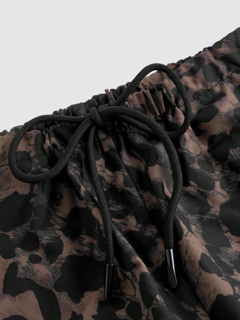 Stylish women's leopard print cargo trousers with a relaxed, wide-leg silhouette, perfect for a chic casual look.