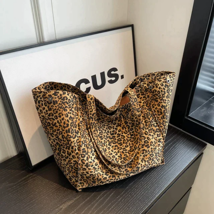 Women's stylish leopard print handbag with spacious interior, ideal for daily fashion