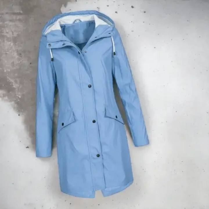 Women's stylish long hooded waterproof raincoat for all-weather outdoor protection. Lightweight & fashionable rain jacket.