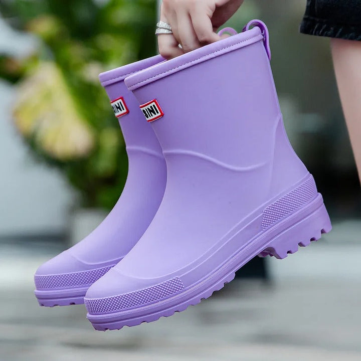 Women's stylish mid-calf rain boots, waterproof for wet weather. Fashionable & comfortable footwear.