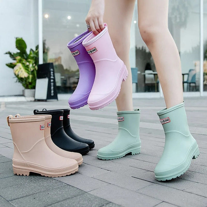 AquaStride 2.0 stylish mid-calf rain boots. Women's waterproof fashion footwear for wet weather.
