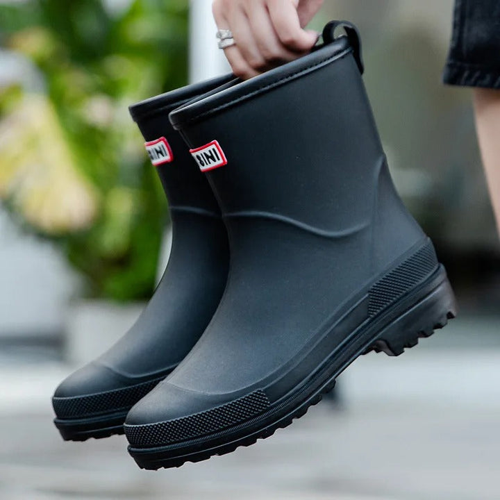 AquaStride 2.0 waterproof mid-calf rain boots for women. Stylish & practical wet weather footwear.