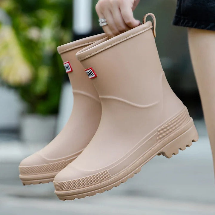 Durable waterproof mid-calf rain boots. Women's stylish fashion boots for wet conditions.