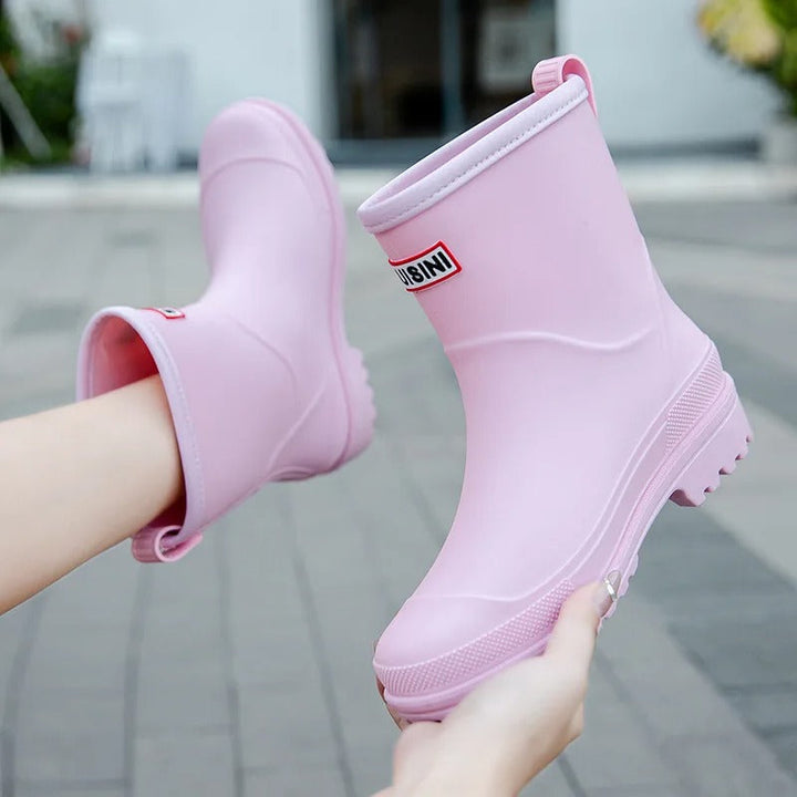 Protective mid-calf waterproof rain boots for women. Stay dry in stylish, casual footwear.