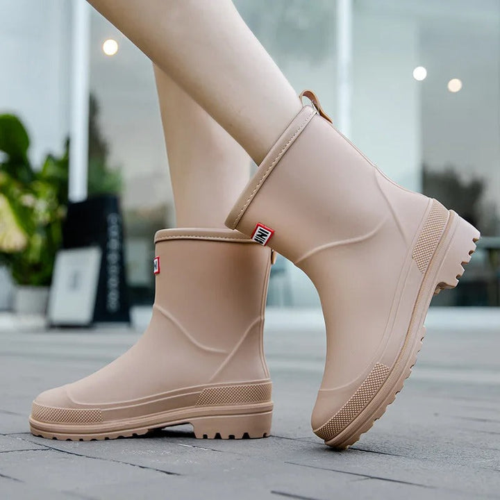 Versatile mid-calf rain boots for women. Waterproof, stylish, and comfortable for casual wear.