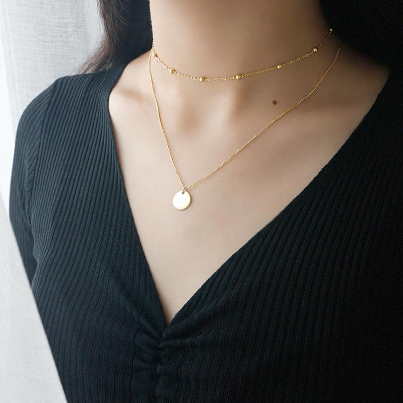 Dainty gold multilayer chain necklace for women. A versatile, elegant accessory to elevate any outfit.