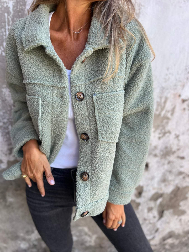 Model showcasing a chic women's notch collar button-up autumn coat, essential for stylish fall fashion.
