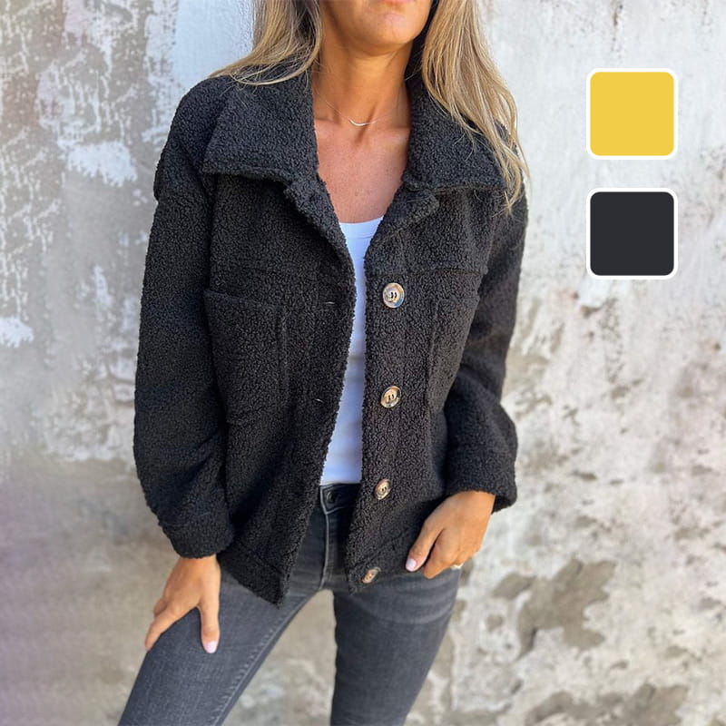 Detail shot of a women's button-up autumn coat with a stylish notch collar, perfect for fall fashion & outerwear.