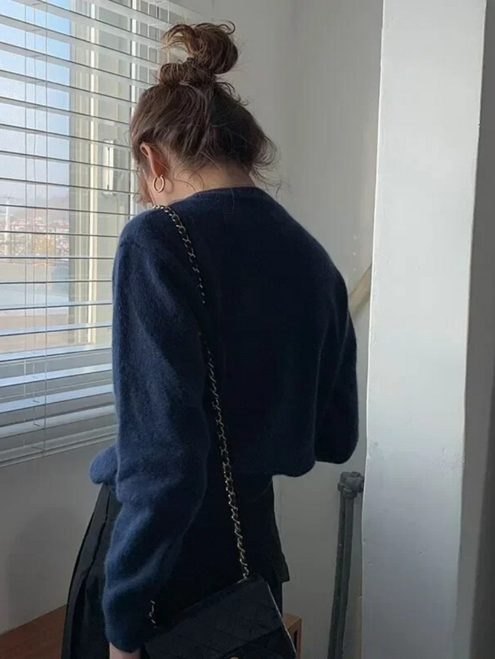 Elegant women's knitted o-neck cardigan. Ideal versatile layering piece for fall fashion and winter wear.