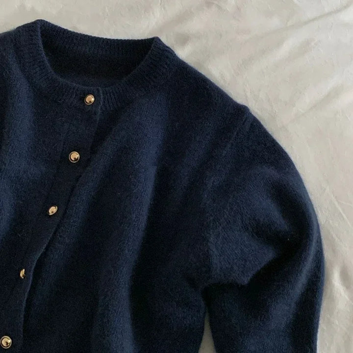 Women's stylish o-neck knitted cardigan. Effortless style for casual wear or elegant layering. Wardrobe essential.