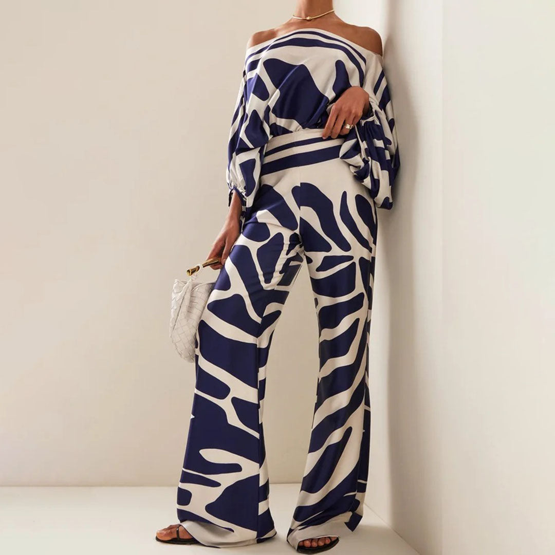 Stylish off-shoulder top and shorts two-piece set. Women's casual printed summer fashion with lantern sleeves.