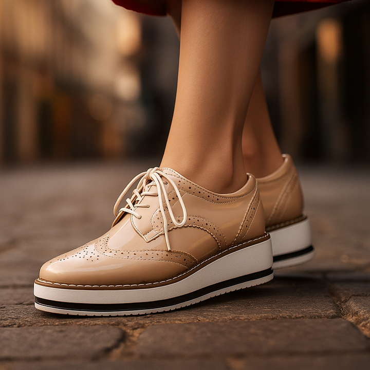 Classic black women's platform oxfords, stylish & comfortable with perforated design for walking.