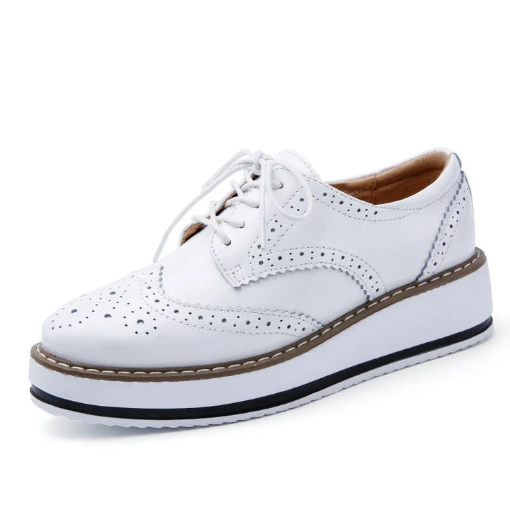 Women's perforated platform oxfords in classic black, stylish & comfortable for walking all day.