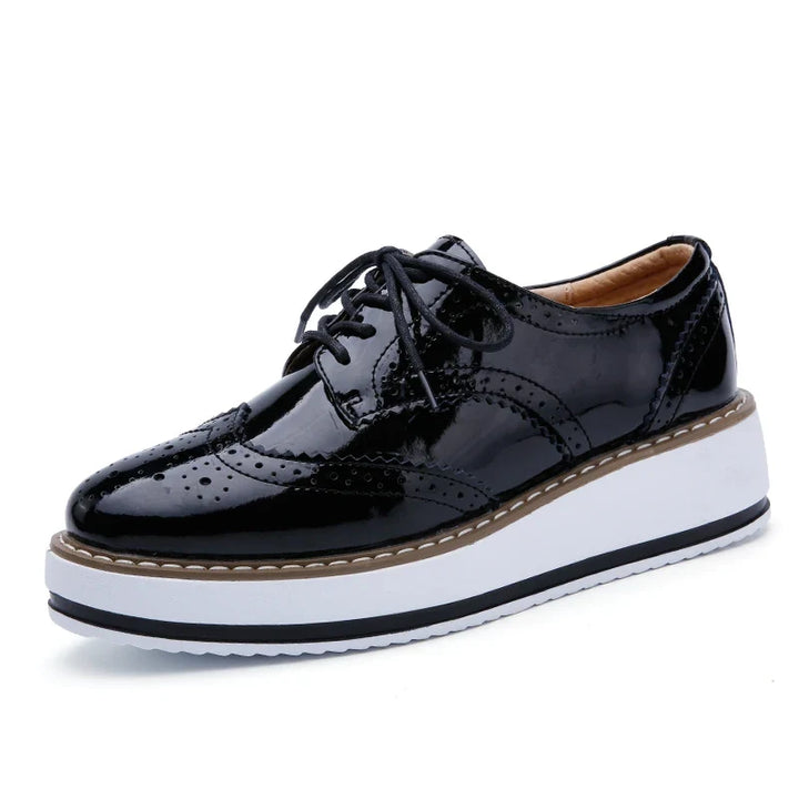 Supportive women's platform oxfords, ultimate comfort for walking, stylish perforated design.