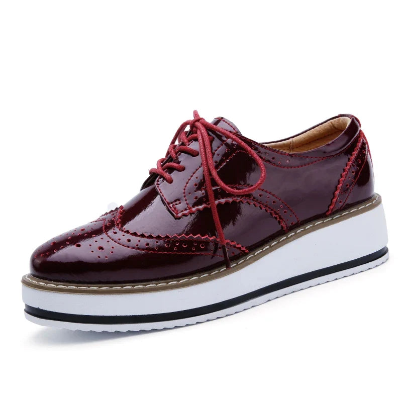 Stylish women's platform oxford shoes, comfortable & perforated, available in various chic colors.