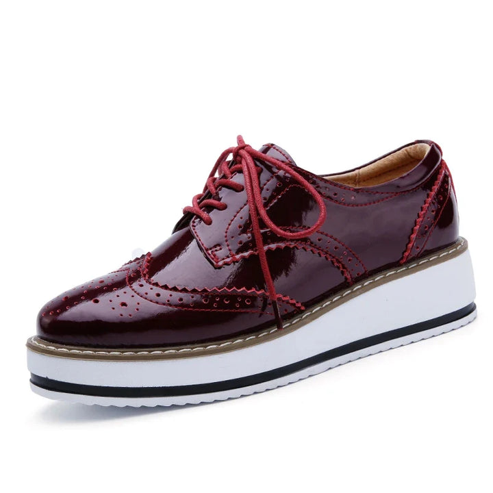 Stylish women's platform oxford shoes, comfortable & perforated, available in various chic colors.