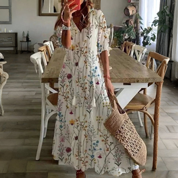 Flowy & comfortable women's printed summer dress, midi length with half sleeves for trendy casual style.