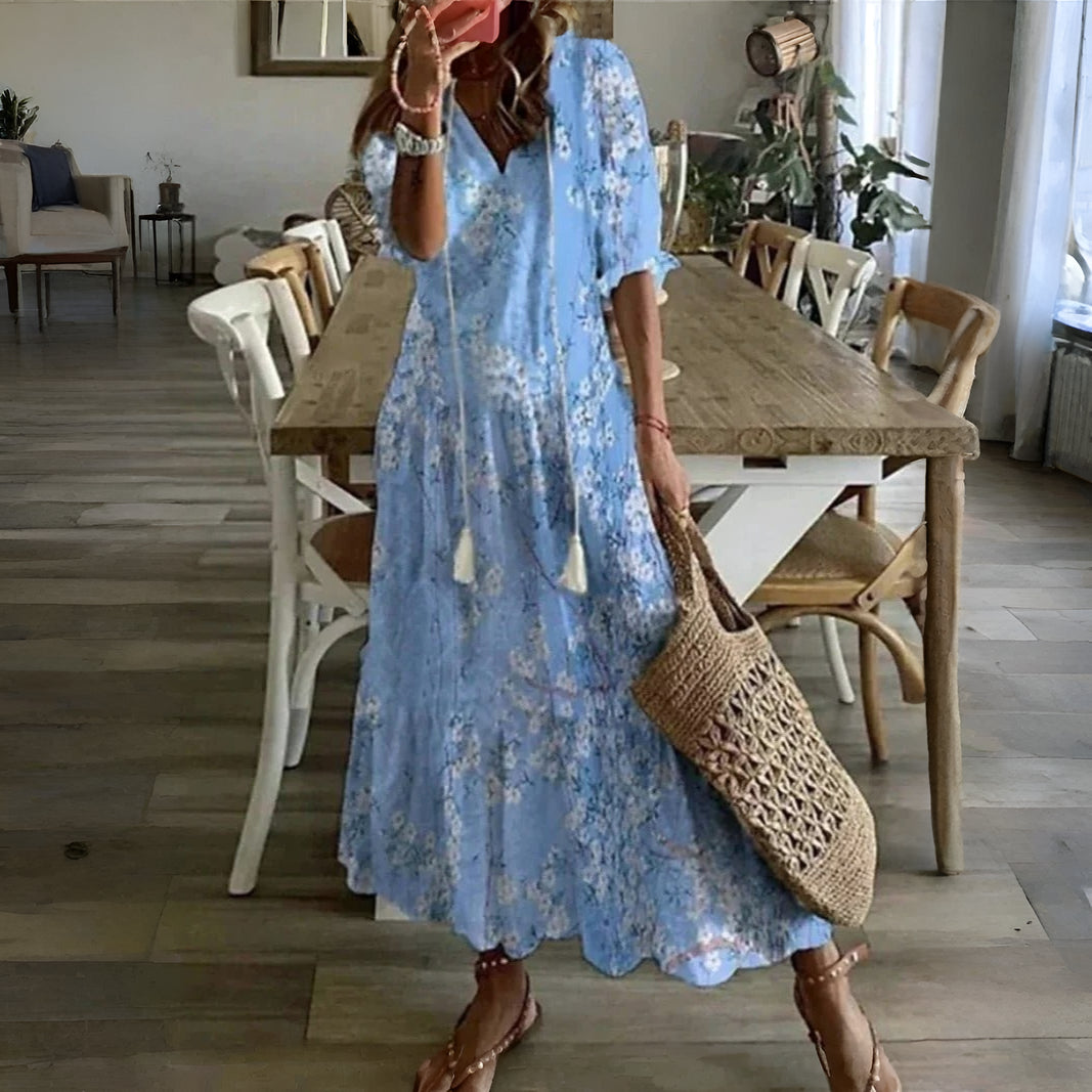Trendy women's printed summer dress, half sleeve midi length, ideal for vacation or everyday casual wear.