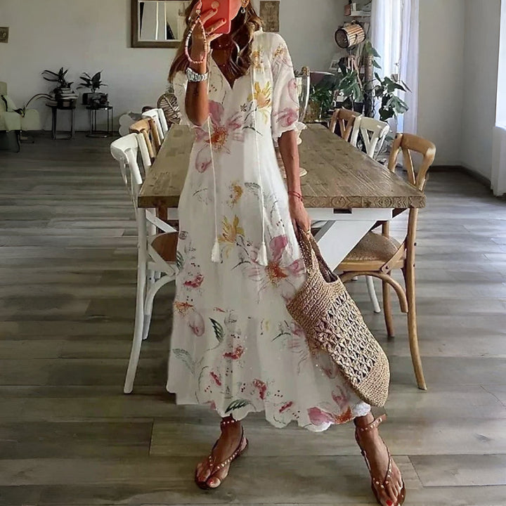 Women's half sleeve printed midi summer dress. Stylish, comfortable, and flowy, great for casual or vacation outfits.